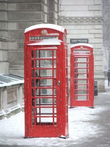 red uk phone booths in the snow