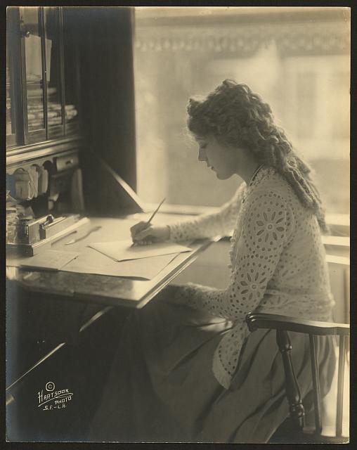 mary pickford at writing desk_loc_public domain