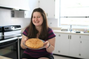 woman holding freshly baked Communion loaf